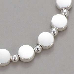 close up of silver circles and beads bracelet