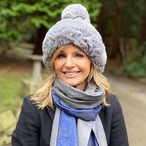 grey warm bobble hat on lady