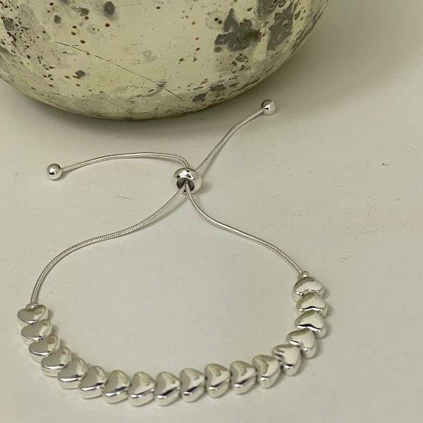 silver glossy hearts friendship bracelet by gracee jewellery