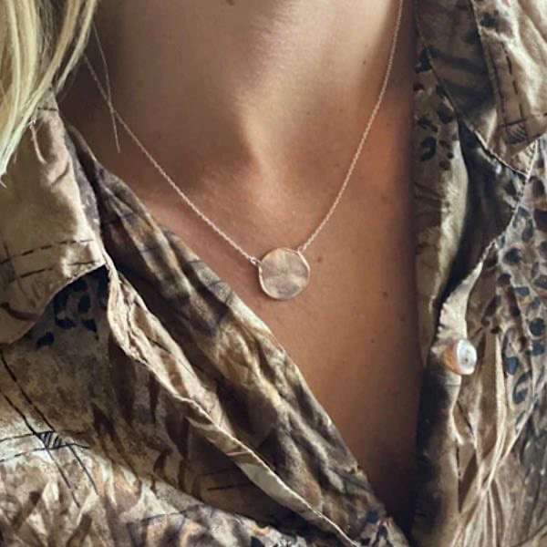 penny necklace on ladies neck