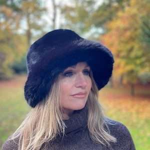 Black luxury furry bucket hat on model