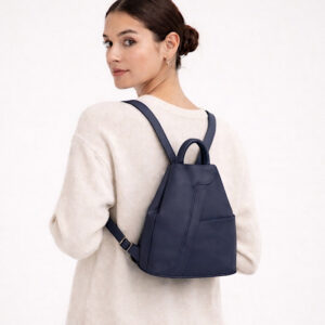 navy leather backpack on woman