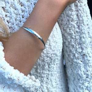 Sterling silver bangle with a slight curve
