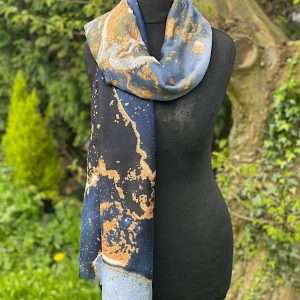blue scarf with raw edge and abstract design