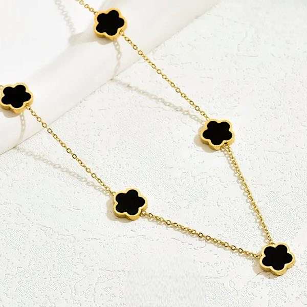 clover necklace on light background