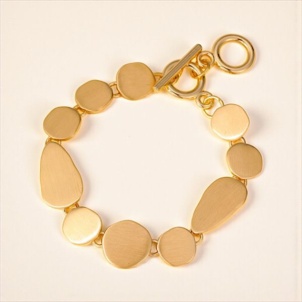 gold bracelet laid out
