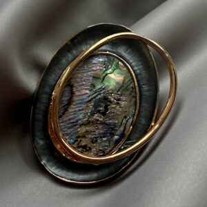 irredesant gold brooch
