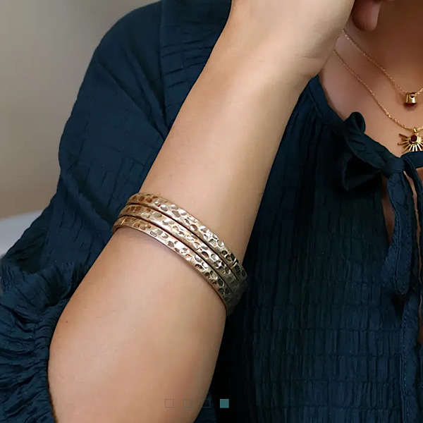 gold bangle on wrist