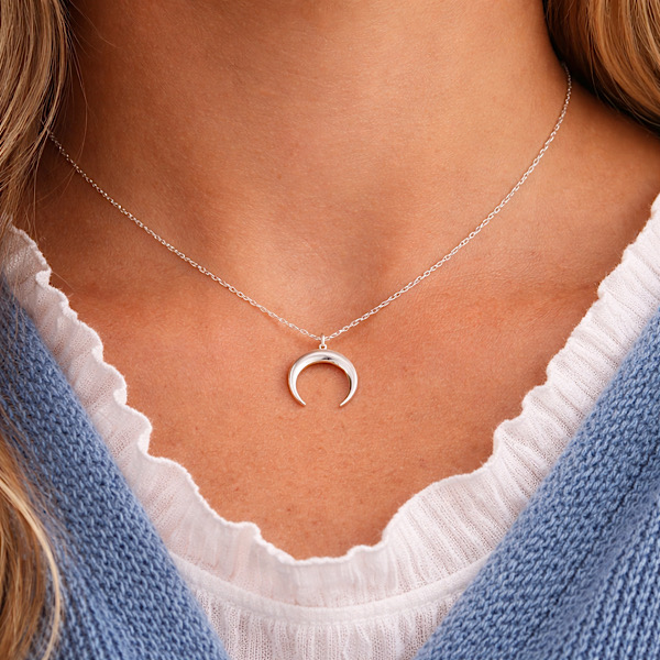 woman wearing elegant crescent moon necklace silver