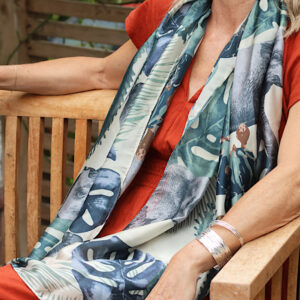 woman wearing green botanical scarf outfit