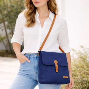 woman wearing navy cross body bag
