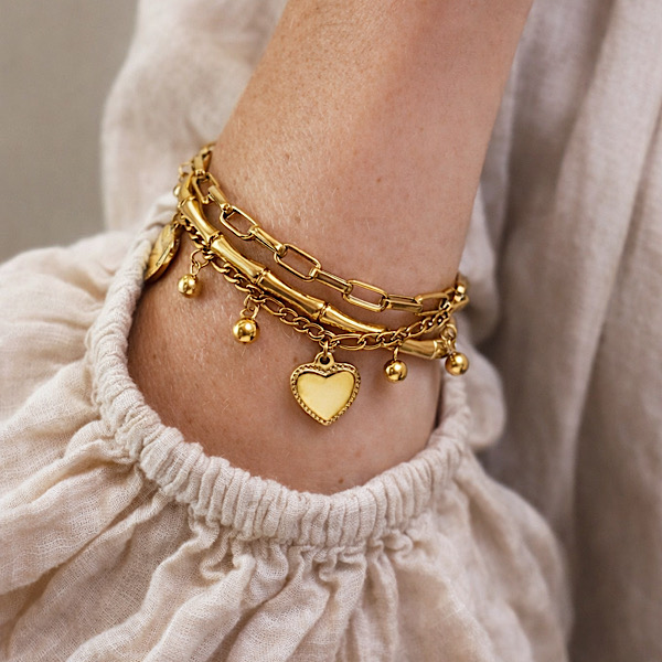 stacked gold charm bracelet everyday wear
