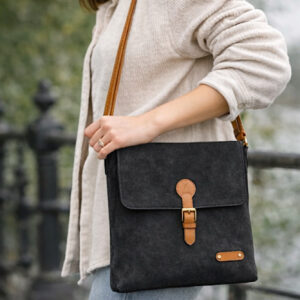 woman wearing black cross body bag