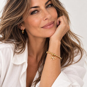 gold dragonfly bracelet on wrist