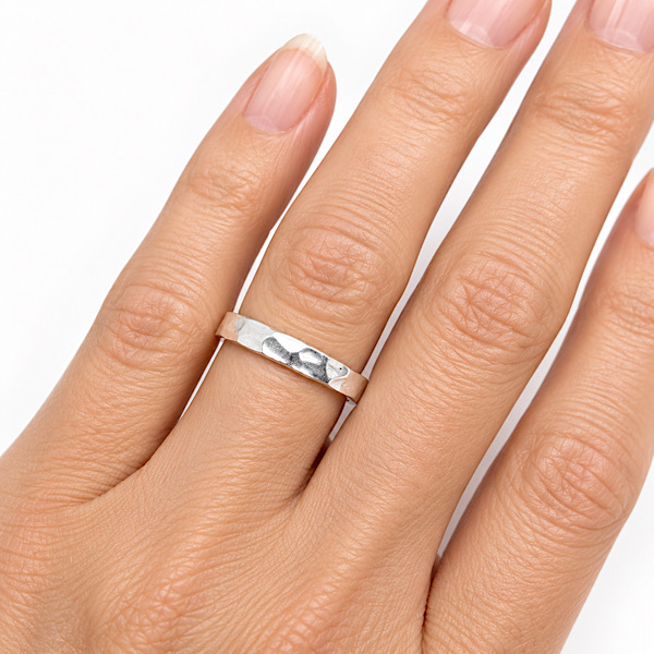 hand hammered silver ring on finger