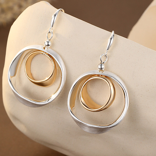 silver plated mixed metal drop earrings with gold-tone centres