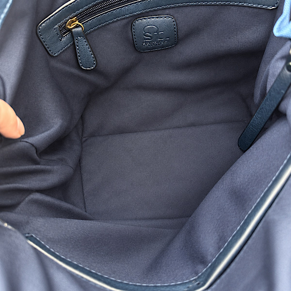 spacious navy shoulder bag interior with pockets